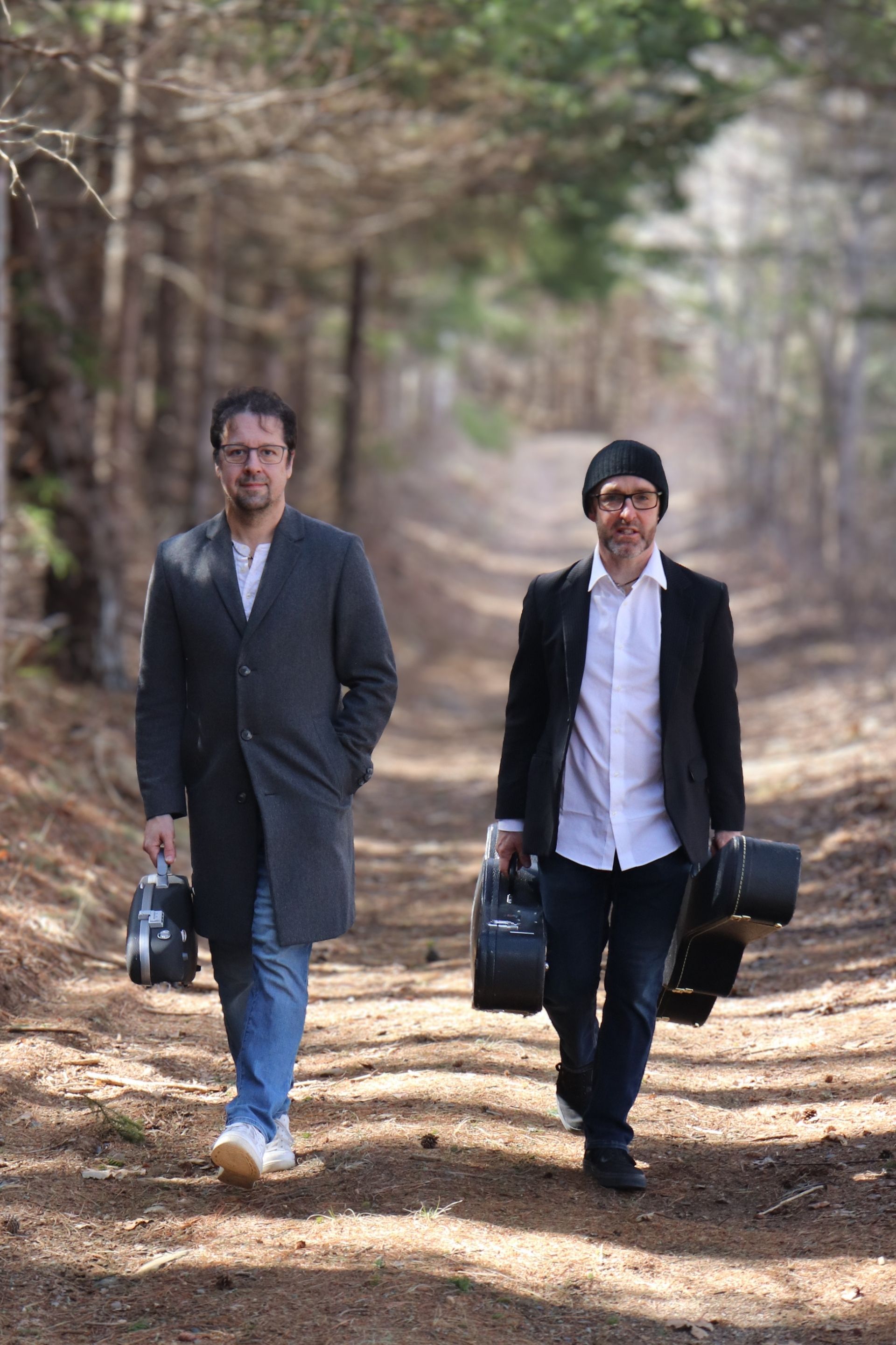 Finney and Webster walking with instrument cases